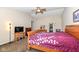 Main bedroom showcasing a large bed, tv, and a walk-in closet at 1058 W Limestone Way, Fortville, IN 46040