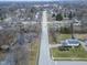 A view of the neighborhood displaying neat lawns, tree-lined streets, and proximity to community amenities at 11035 W Lakeshore Dr, Carmel, IN 46033