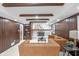 Spacious basement featuring a comfortable leather sectional, white brick fireplace, and wood paneled walls at 11035 W Lakeshore Dr, Carmel, IN 46033