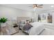 Inviting bedroom with a ceiling fan and window overlooking outdoors at 11035 W Lakeshore Dr, Carmel, IN 46033