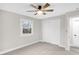 Bedroom featuring a ceiling fan, window, and closet at 11035 W Lakeshore Dr, Carmel, IN 46033