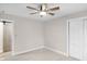 Spacious bedroom featuring a ceiling fan and closet space at 11035 W Lakeshore Dr, Carmel, IN 46033