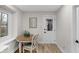 Cozy breakfast nook with a round wood table, chairs, and a sunlit window at 11035 W Lakeshore Dr, Carmel, IN 46033