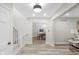 Inviting entryway with view of the dining room and staircase at 11035 W Lakeshore Dr, Carmel, IN 46033