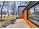 Modern home exterior with wood siding, large windows, and landscaped accents at 11035 W Lakeshore Dr, Carmel, IN 46033