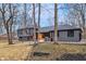 Beautiful two-story gray home with a striking wood exterior at 11035 W Lakeshore Dr, Carmel, IN 46033