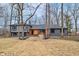 Stunning two-story home with modern gray brick, wood accents, and professional landscaping at 11035 W Lakeshore Dr, Carmel, IN 46033
