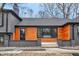 Modern home with a beautiful wood exterior and gray brick at 11035 W Lakeshore Dr, Carmel, IN 46033