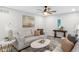 Inviting living room with modern decor, plush seating, and stylish ceiling fan at 11035 W Lakeshore Dr, Carmel, IN 46033