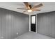 Enclosed room featuring a ceiling fan, neutral carpet, and a door leading to the outside at 11035 W Lakeshore Dr, Carmel, IN 46033
