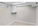 Basement storage area featuring a small window and upper cabinets at 11035 W Lakeshore Dr, Carmel, IN 46033