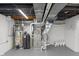 Basement utility room featuring a water heater and HVAC system at 11035 W Lakeshore Dr, Carmel, IN 46033