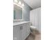 Bright bathroom featuring a white vanity, modern fixtures, and a shower with a white curtain at 1135 Sherwood Dr, Danville, IN 46122