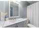 Modern bathroom featuring a sink with vanity and a large mirror and shower at 1135 Sherwood Dr, Danville, IN 46122