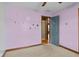 Bedroom featuring carpeted floors and light lilac walls at 1135 Sherwood Dr, Danville, IN 46122