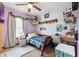 bedroom with a blue plaid bed set, wood desk, and lots of toys at 1135 Sherwood Dr, Danville, IN 46122