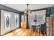 Charming dining area with hardwood floors and decorative light fixture at 1135 Sherwood Dr, Danville, IN 46122