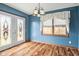 Bright dining area with hardwood floors and elegant lighting fixtures at 1135 Sherwood Dr, Danville, IN 46122