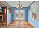 Dining area with hardwood floors, a decorative chandelier, and natural light at 1135 Sherwood Dr, Danville, IN 46122
