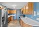 Kitchen featuring stainless steel appliances, wood cabinets, and lots of countertop space at 1135 Sherwood Dr, Danville, IN 46122