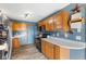 Functional kitchen with natural wood cabinets, stainless steel appliances, and ample countertop space at 1135 Sherwood Dr, Danville, IN 46122