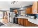 Cozy kitchen featuring natural wood cabinetry and stainless steel appliances at 1135 Sherwood Dr, Danville, IN 46122
