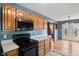 Kitchen with wooden cabinets, stainless steel appliances, and ample counter space at 1135 Sherwood Dr, Danville, IN 46122