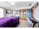 A well lit main bedroom with carpet, windows, and double doors at 1135 Sherwood Dr, Danville, IN 46122