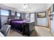 Cozy main bedroom with carpet, gray walls, and windows with natural light at 1135 Sherwood Dr, Danville, IN 46122