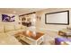 Finished basement with comfortable seating, theater screen and wet bar for movie nights at 13139 Dumbarton St, Carmel, IN 46032