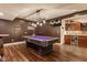 Finished basement featuring a pool table and a wet bar perfect for entertaining guests at 13139 Dumbarton St, Carmel, IN 46032