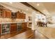 Finished basement featuring a wet bar with dark wood cabinets and herringbone backsplash at 13139 Dumbarton St, Carmel, IN 46032
