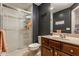 Well-lit bathroom with a glass shower enclosure, tile flooring, and modern vanity at 13139 Dumbarton St, Carmel, IN 46032