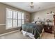 Cozy bedroom featuring a chandelier, neutral walls, and a large window with shutters at 13139 Dumbarton St, Carmel, IN 46032