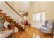 Grand foyer with hardwood floors, staircase, and a beautiful front door with sidelights at 13139 Dumbarton St, Carmel, IN 46032