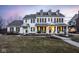 Stately two-story home featuring symmetrical design, dormer windows, and inviting front porch at 13139 Dumbarton St, Carmel, IN 46032