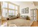 Inviting living room with large windows providing ample natural light and hardwood flooring at 13139 Dumbarton St, Carmel, IN 46032