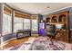 Home office with hardwood floors, natural light, a built-in bookcase and stylish decor at 13139 Dumbarton St, Carmel, IN 46032