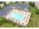 Aerial view of a community pool surrounded by lounge chairs and umbrellas at 17223 Gunther Blvd # 310, Westfield, IN 46074