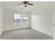 A well-lit bedroom featuring neutral carpet and paint, complemented by a ceiling fan at 17223 Gunther Blvd # 310, Westfield, IN 46074