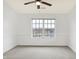 Bright bedroom with neutral carpeting, paint and trim, along with a large window with a view of the neighborhood at 17223 Gunther Blvd # 310, Westfield, IN 46074