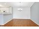 Bright dining area with hardwood floors and a modern chandelier at 17223 Gunther Blvd # 310, Westfield, IN 46074