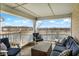 Relaxing covered patio with comfortable seating and scenic pond views at 17223 Gunther Blvd # 310, Westfield, IN 46074