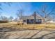 A view of the back of the home showing the deck, two-tone siding and large yard at 227 W 7Th St, Lapel, IN 46051