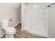 Bathroom with a tiled shower, wood-look floors, and modern toilet at 227 W 7Th St, Lapel, IN 46051