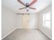 Bedroom featuring new flooring and a barn door, creating a modern look at 227 W 7Th St, Lapel, IN 46051
