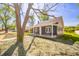 Stylish home featuring a covered porch, gray siding, white trim, and a beautifully landscaped yard at 227 W 7Th St, Lapel, IN 46051