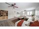 Bright living area featuring hardwood floors, a neutral color scheme, and a cozy seating arrangement at 227 W 7Th St, Lapel, IN 46051