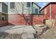 View of backyard with a concrete patio, door to house, and potential garden area at 235 E 11Th St, Indianapolis, IN 46202