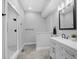 Bathroom with walk-in shower, modern vanity, and tiled floors at 235 E 11Th St, Indianapolis, IN 46202